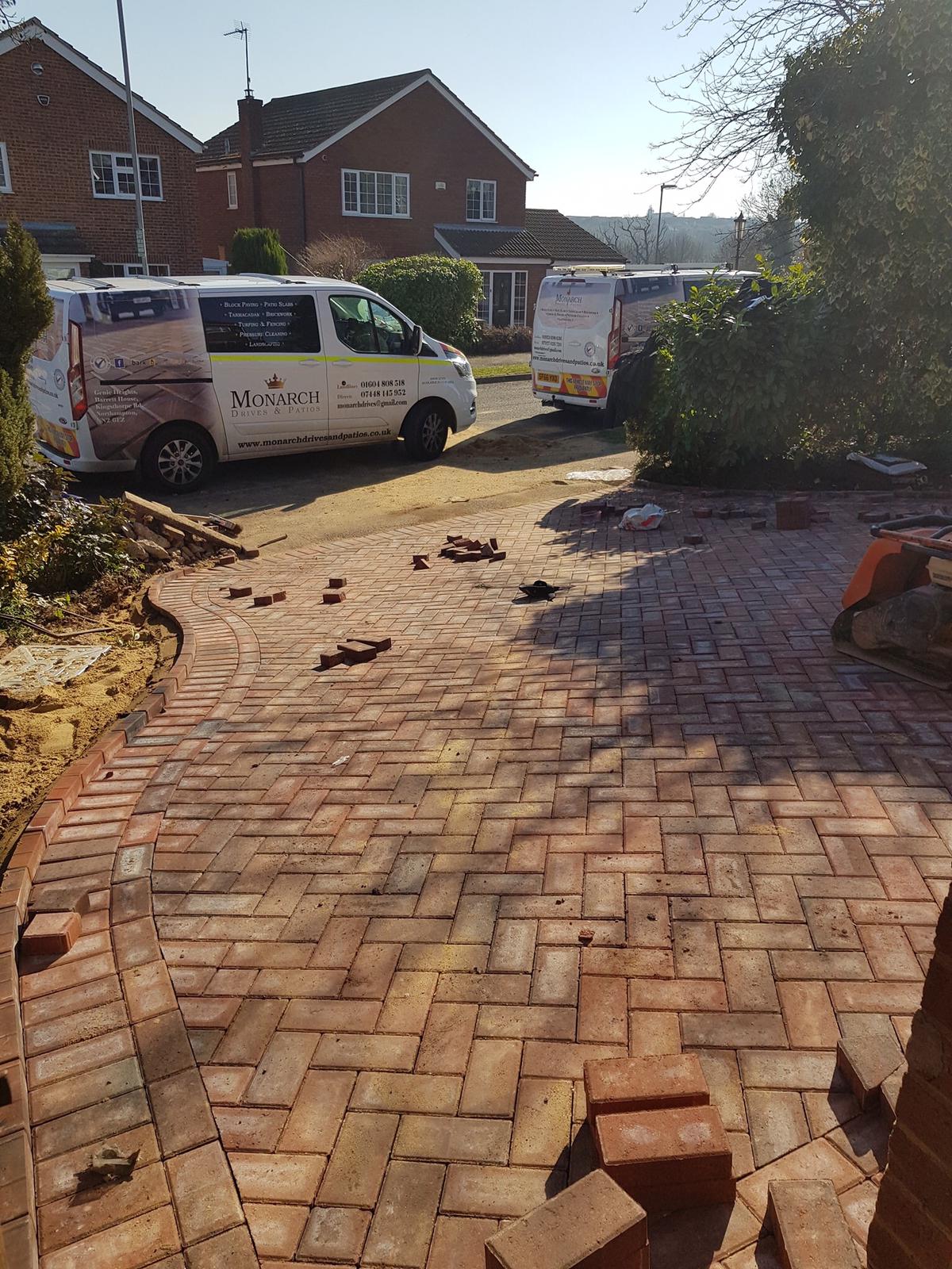 Herringbone driveway being laid with the Monarch Drives & Patios van parked behind