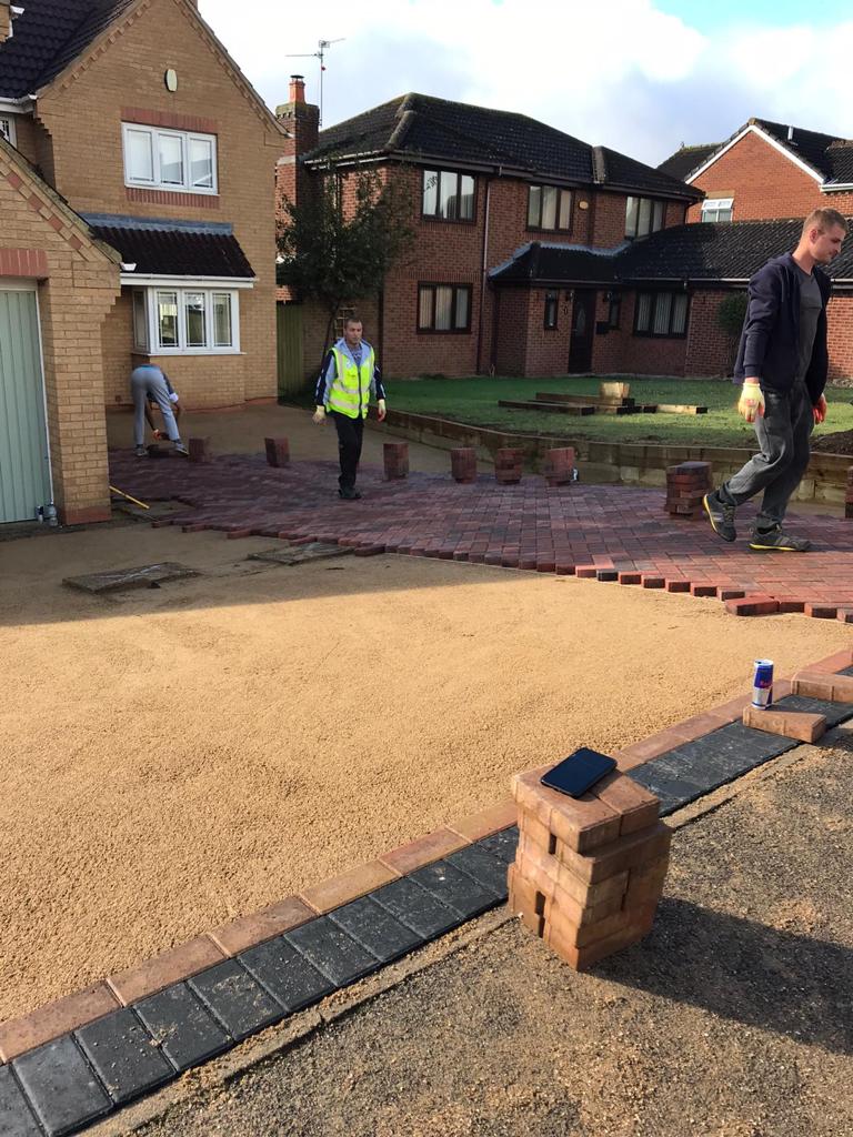 Sub base laid and charcoal edging set, with the team on site